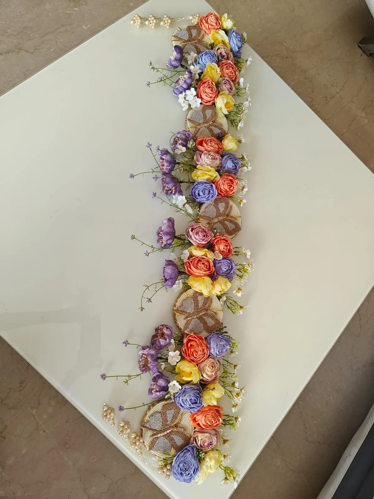 Elevated butterflies on a pearl base of 4 with enhancement of flowers in bright combination with lavender hangings-BRIJ001DT