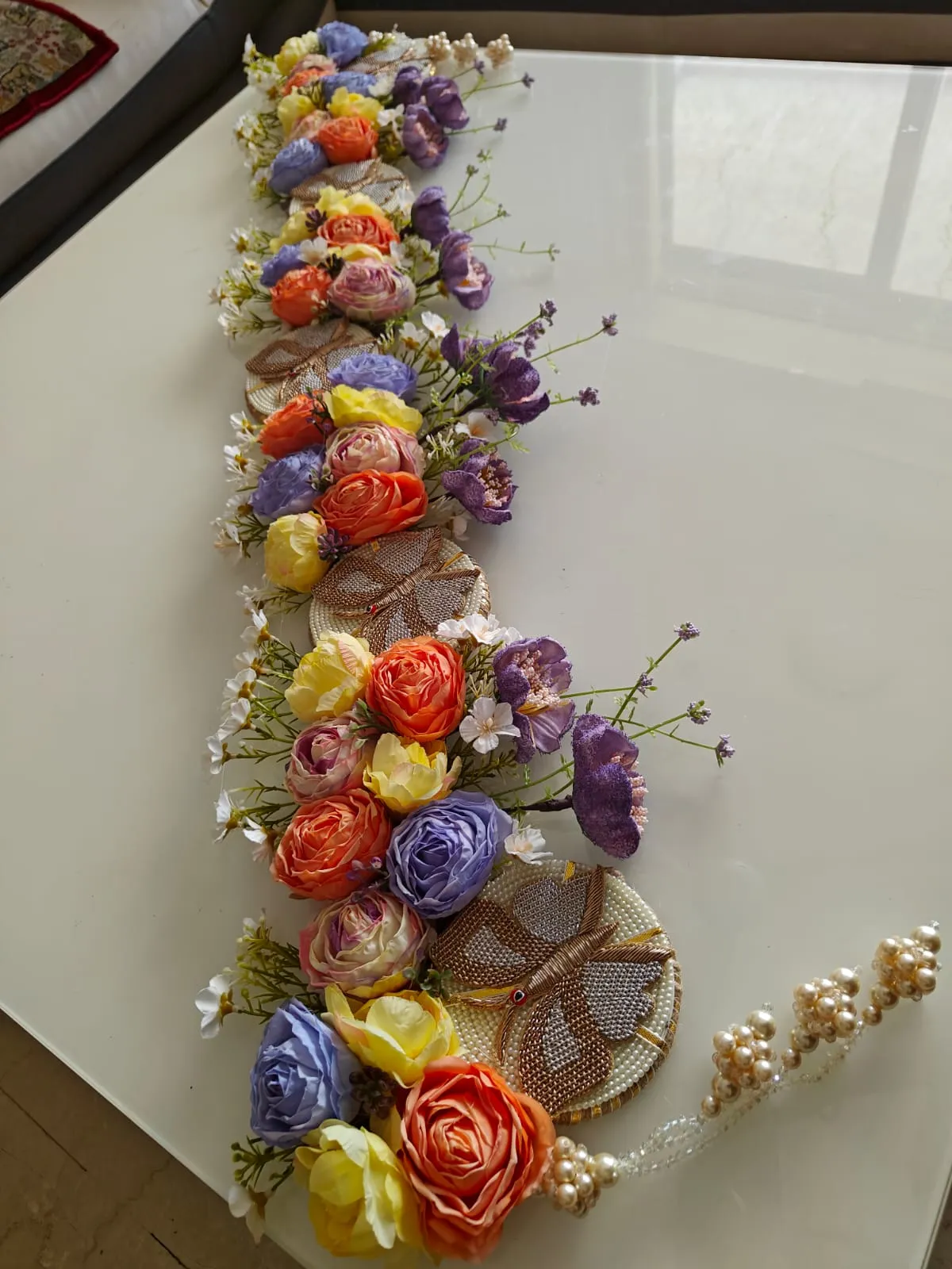 Elevated butterflies on a pearl base of 4 with enhancement of flowers in bright combination with lavender hangings-BRIJ001DT